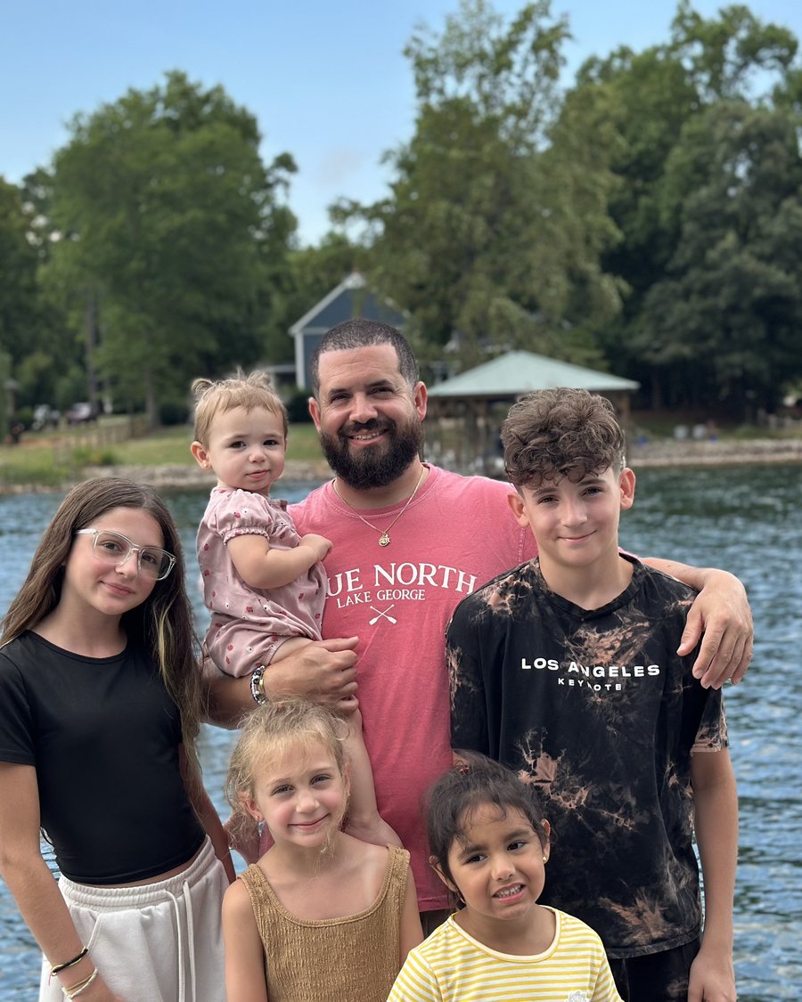 Will, Hudson Ally's founder, with the kids at the lake